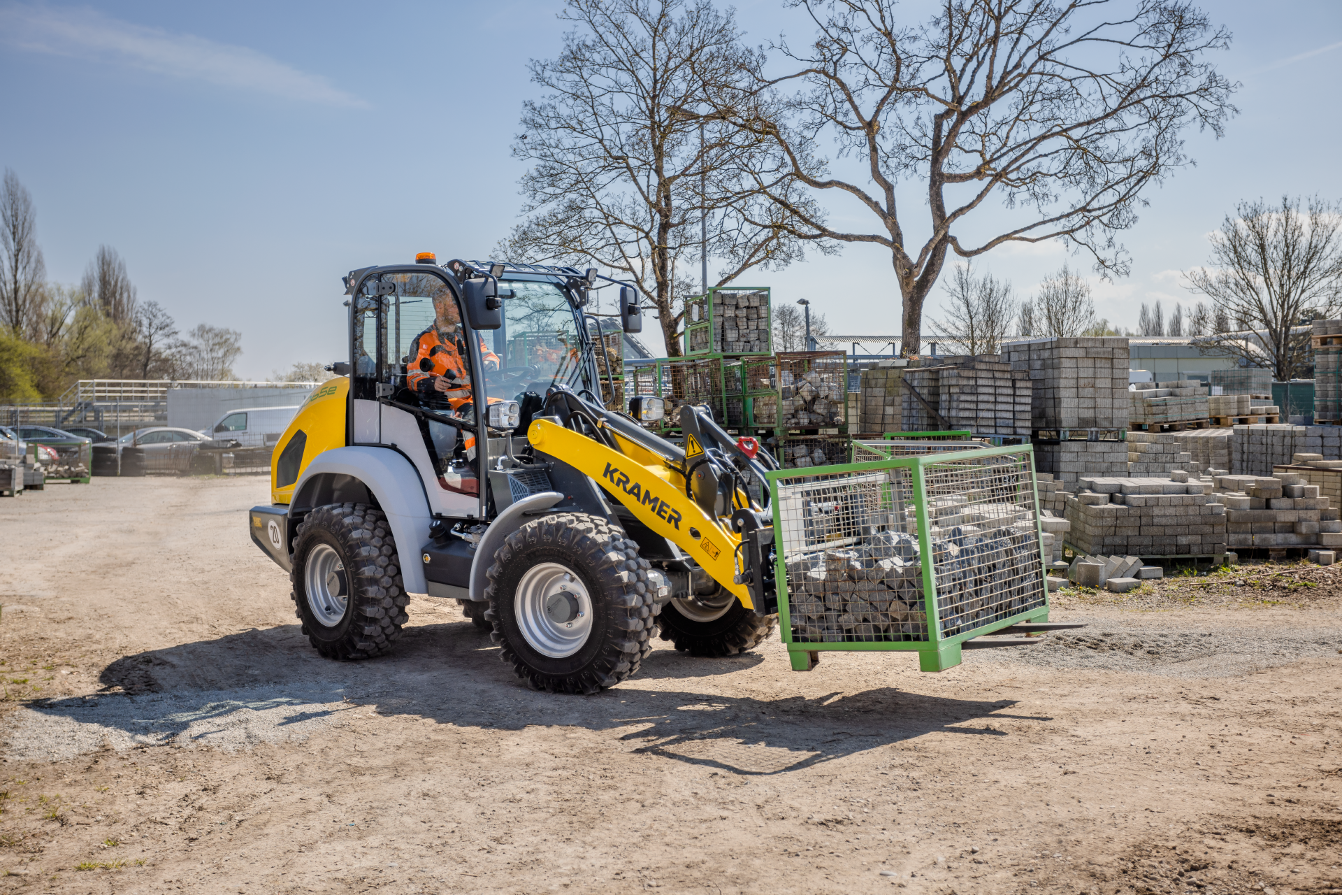 The fully electric Kramer wheel loader 5065e while transporting stones.