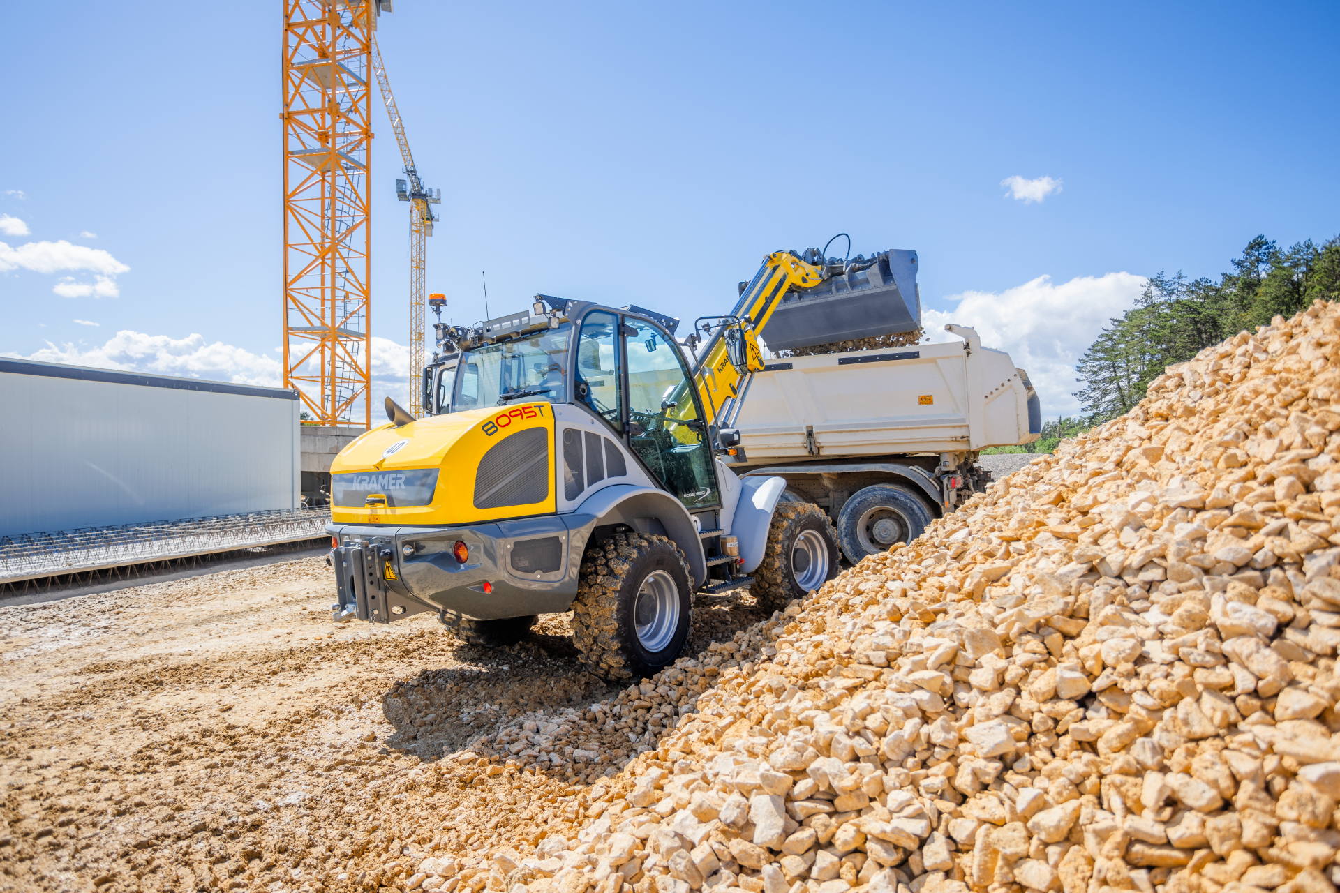 The Kramer telescopic wheel loader 8095T while loading stones.