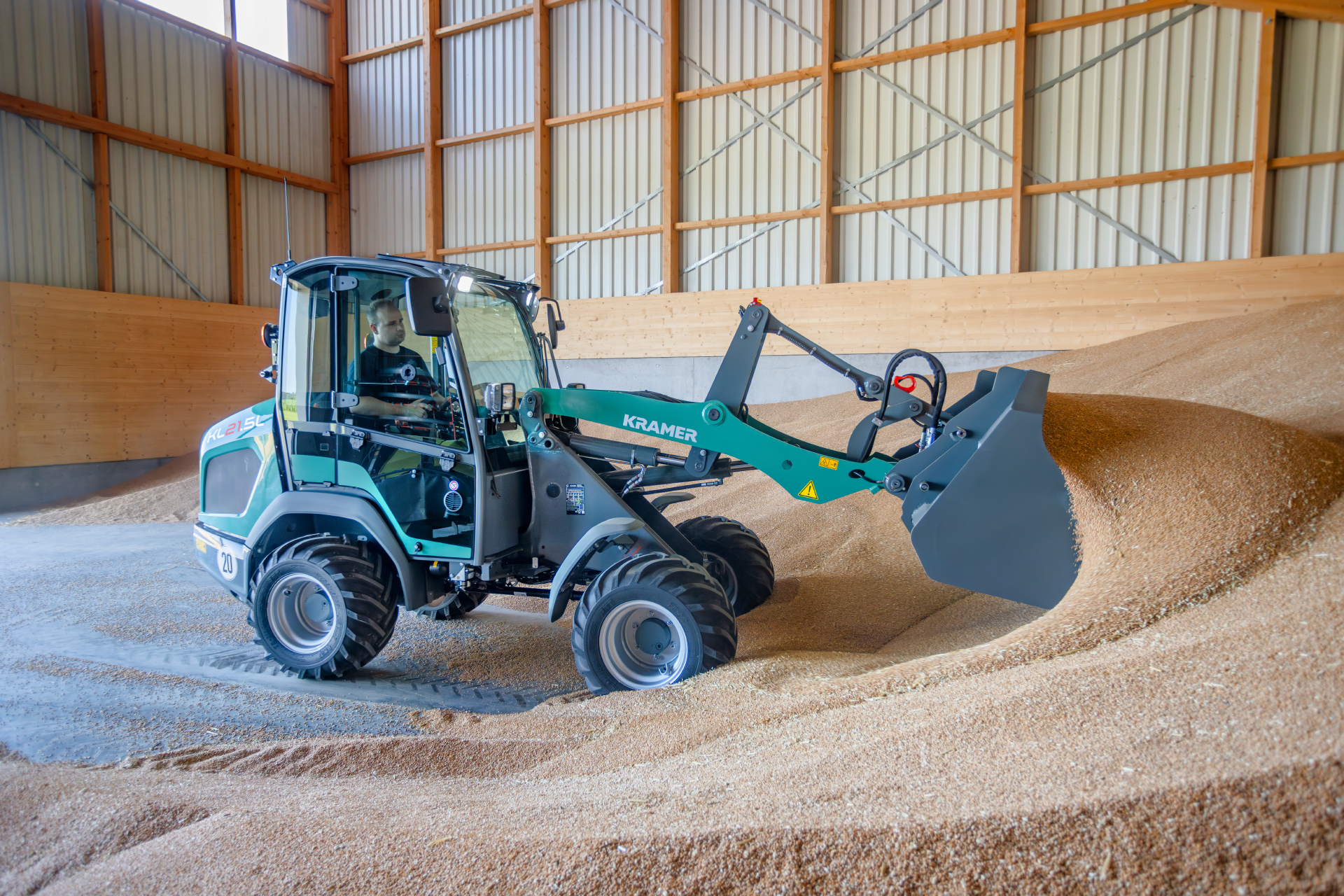 The Kramer KL21.5L wheel loader loading grain.